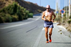 Older man running in the heat